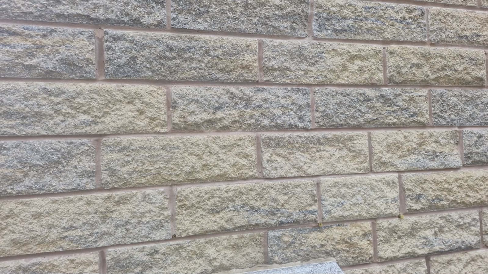 Close-up of completed natural stone walling with tight, consistent mortar joints
