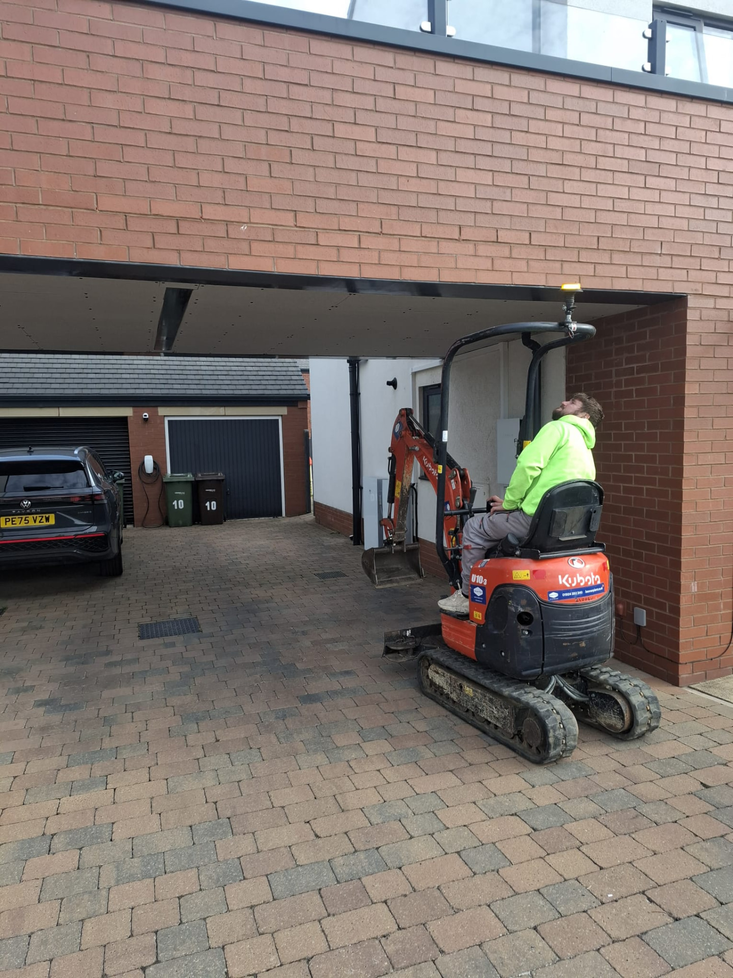Excavation work under a carport using a mini excavator on a Doncaster groundworks job