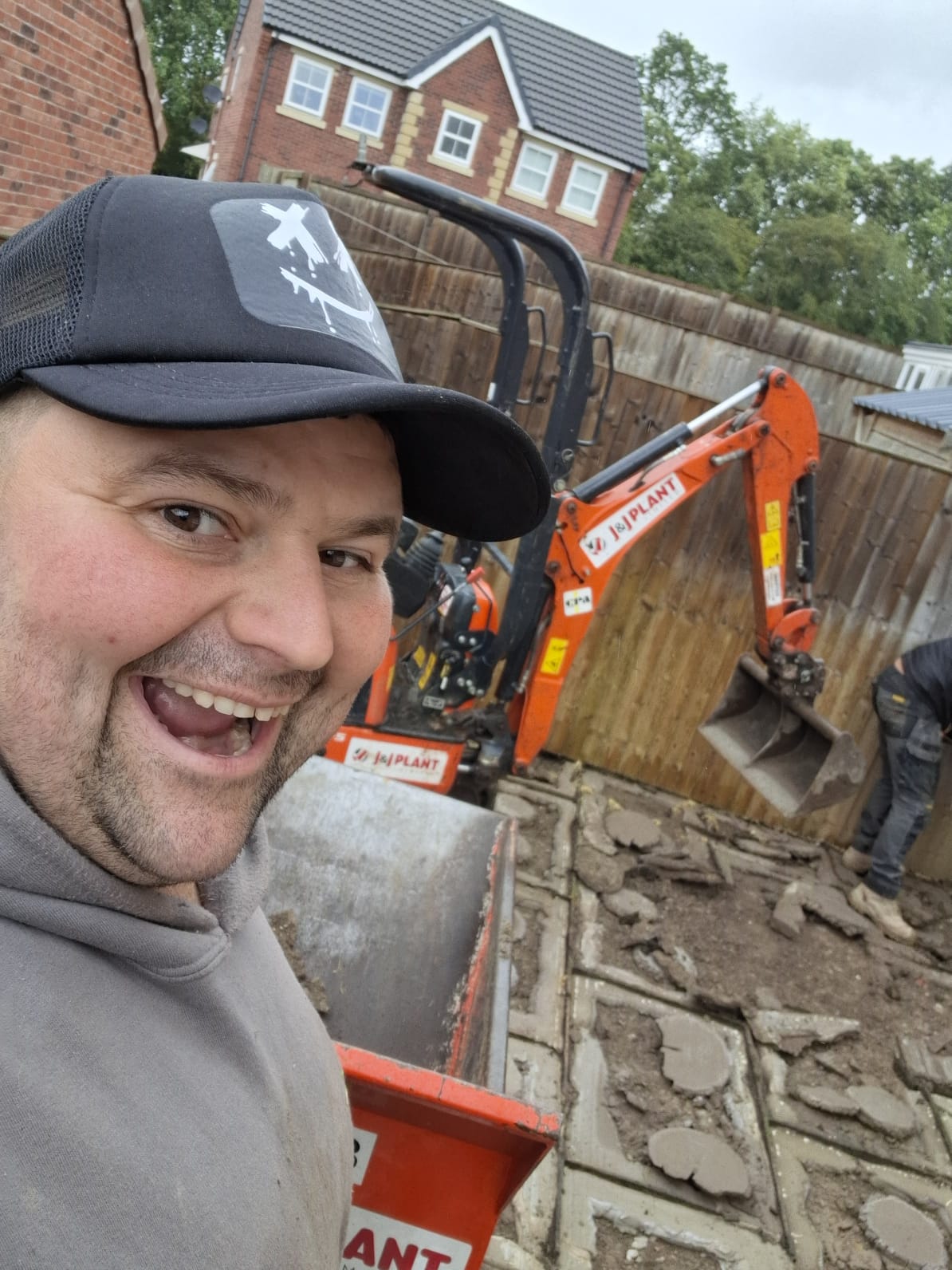 Michael Kirkbride of Surefoot Brickwork Ltd on site with a mini excavator during a Doncaster groundworks job