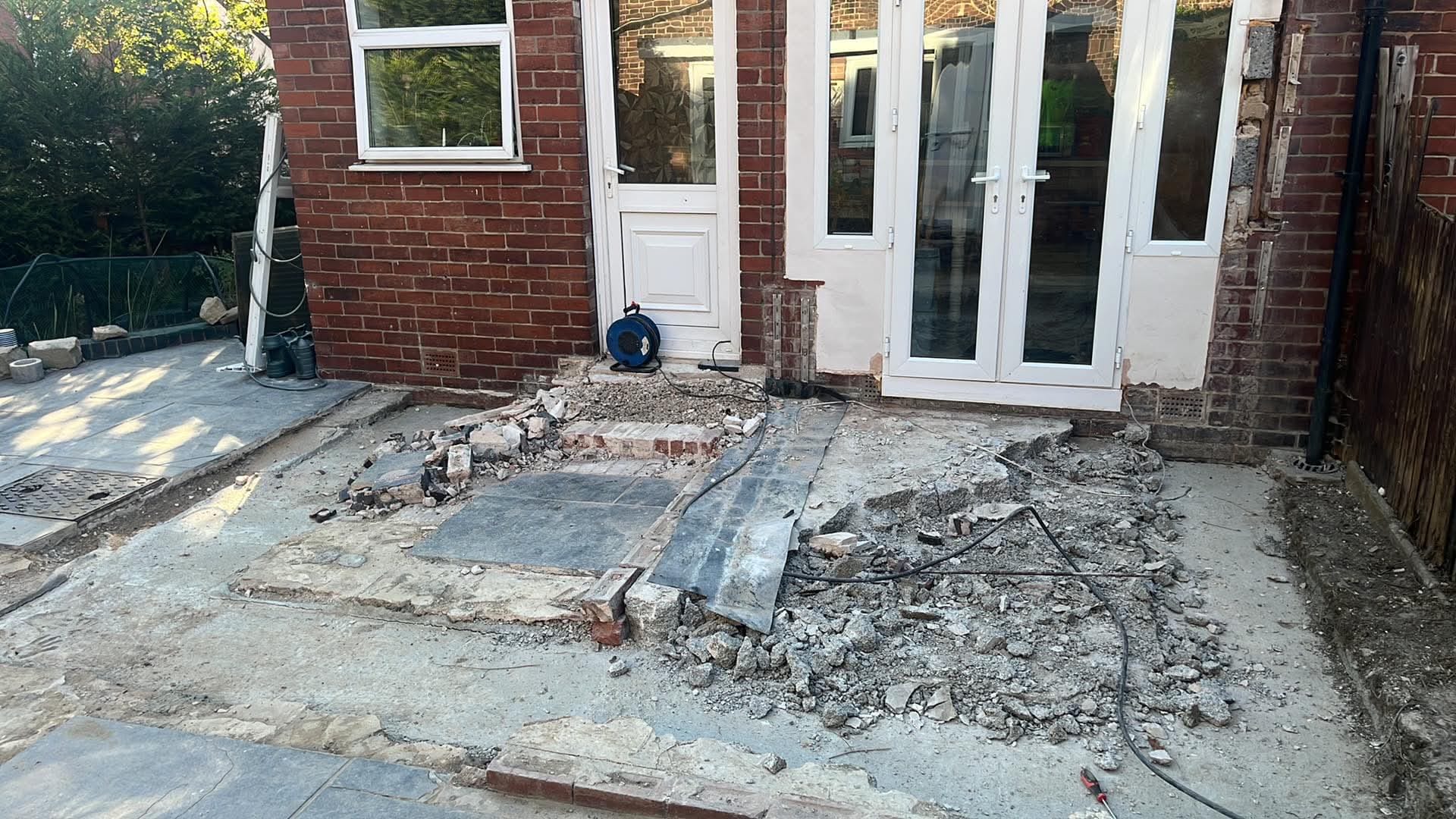 Old patio and steps broken out back to base level before a new patio is laid in Doncaster